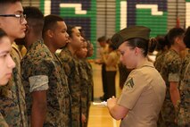 Marines and Sailors with Chemical Biological Incident Response Force, U.S. Marine Corps Forces Command, volunteered their time to conduct a JROTC uniform inspection at St. Charles High School in Waldorf, Md., April 18, 2018. During the inspection the Marines and sailors looked over the students’ uniforms, tested their military knowledge and shared their expertise with the high school students. (Official USMC Photos by Staff Sgt. Santiago G. Colon Jr.)