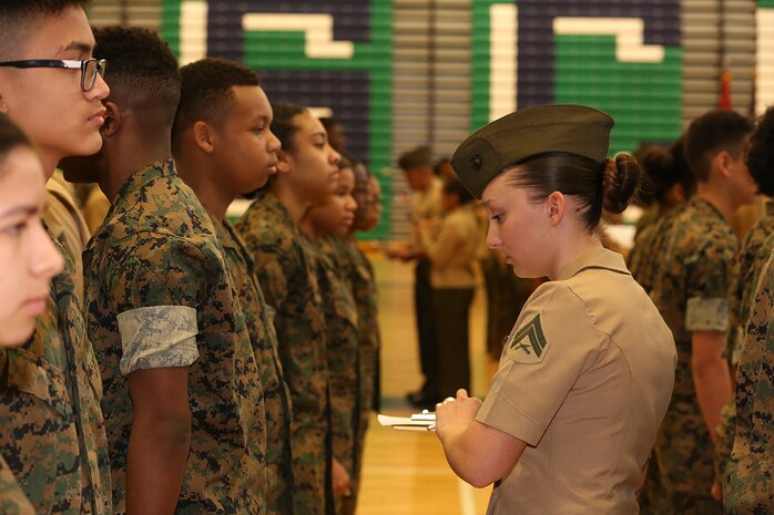 Marines and Sailors with Chemical Biological Incident Response Force, U.S. Marine Corps Forces Command, volunteered their time to conduct a JROTC uniform inspection at St. Charles High School in Waldorf, Md., April 18, 2018. During the inspection the Marines and sailors looked over the students’ uniforms, tested their military knowledge and shared their expertise with the high school students. (Official USMC Photos by Staff Sgt. Santiago G. Colon Jr.)