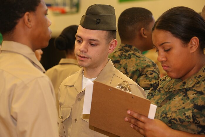 Marines and Sailors with Chemical Biological Incident Response Force, U.S. Marine Corps Forces Command, volunteered their time to conduct a JROTC uniform inspection at St. Charles High School in Waldorf, Md., April 18, 2018. During the inspection the Marines and sailors looked over the students’ uniforms, tested their military knowledge and shared their expertise with the high school students. (Official USMC Photos by Staff Sgt. Santiago G. Colon Jr.)