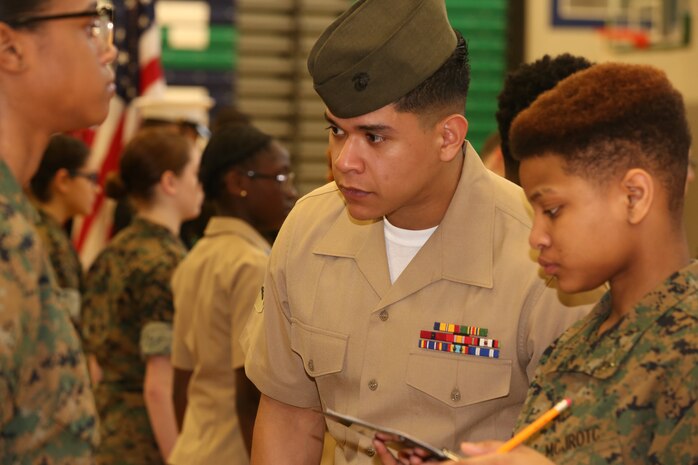 Marines and Sailors with Chemical Biological Incident Response Force, U.S. Marine Corps Forces Command, volunteered their time to conduct a JROTC uniform inspection at St. Charles High School in Waldorf, Md., April 18, 2018. During the inspection the Marines and sailors looked over the students’ uniforms, tested their military knowledge and shared their expertise with the high school students. (Official USMC Photos by Staff Sgt. Santiago G. Colon Jr.)