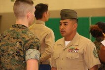Marines and Sailors with Chemical Biological Incident Response Force, U.S. Marine Corps Forces Command, volunteered their time to conduct a JROTC uniform inspection at St. Charles High School in Waldorf, Md., April 18, 2018. During the inspection the Marines and sailors looked over the students’ uniforms, tested their military knowledge and shared their expertise with the high school students. (Official USMC Photos by Staff Sgt. Santiago G. Colon Jr.)