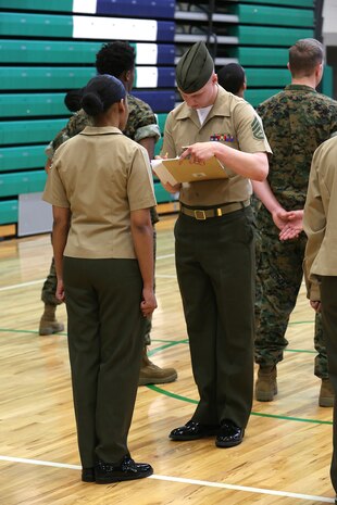 Marines and Sailors with Chemical Biological Incident Response Force, U.S. Marine Corps Forces Command, volunteered their time to conduct a JROTC uniform inspection at St. Charles High School in Waldorf, Md., April 18, 2018. During the inspection the Marines and sailors looked over the students’ uniforms, tested their military knowledge and shared their expertise with the high school students. (Official USMC Photos by Staff Sgt. Santiago G. Colon Jr.)