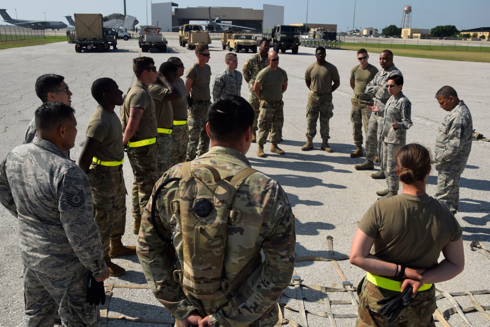 United States Air Force Reserve Command Chief Master Sgt. Ericka E. Kelly and Fourth Air Force Command Chief Master Sgt. Timothy C. White Jr. visit with members of the 74th Aerial Port Squadron and 61st Quartermaster Battalion at the Cargo Load Training facility June 2, 2018, at Joint Base San Antonio-Lackland, Texas. The aerial port squadron trains members to correctly load pallets to ensure aircraft can be loaded safely and efficiently. (U.S. Air Force photo by Staff Sgt. Lauren M. Snyder)