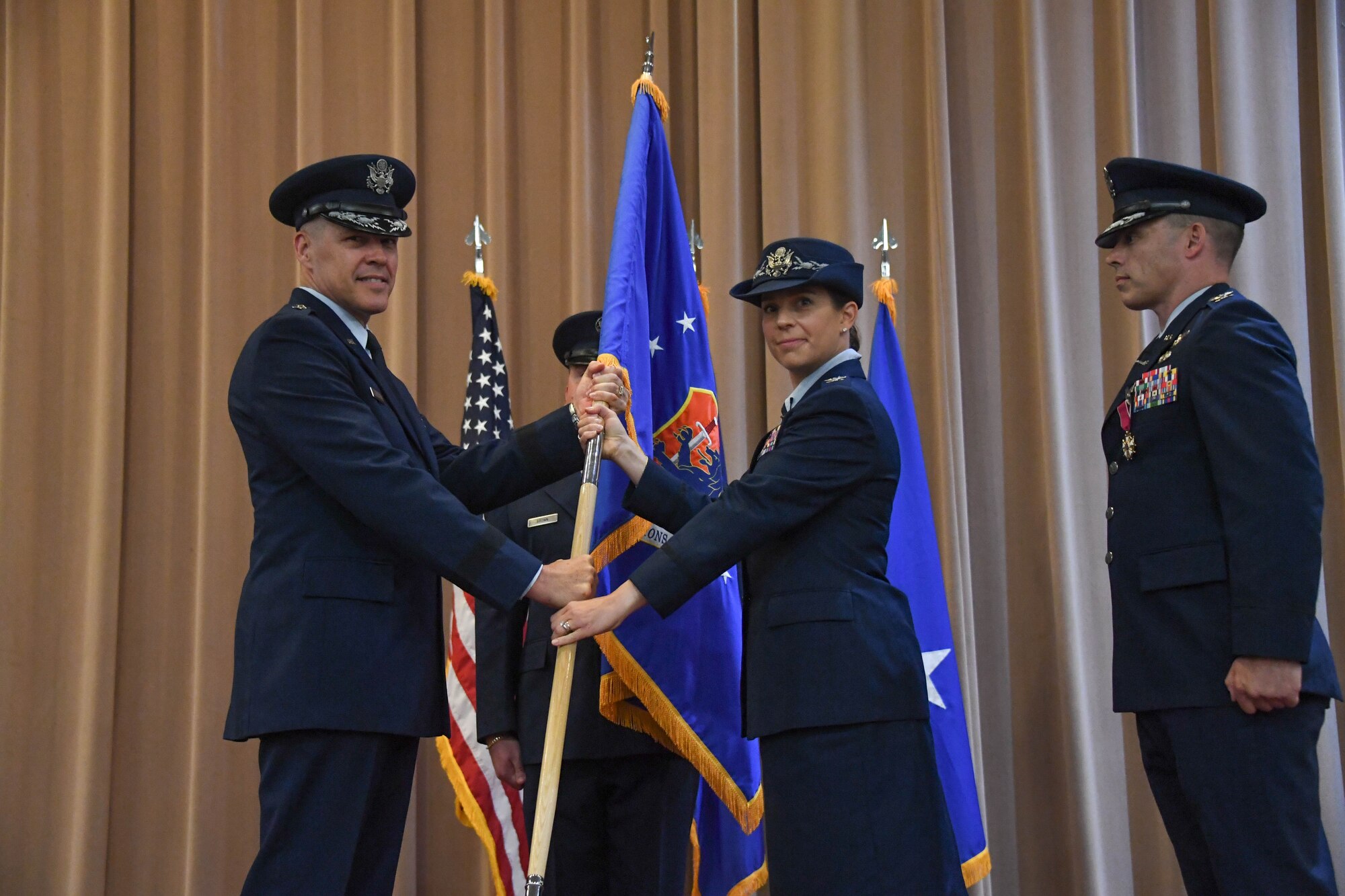 Col. Beth Makros assumes command of the 608th Air Operations Center, during a change of command ceremony at Barksdale Air Force Base, La., June 8, 2018.