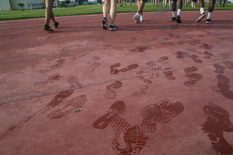 Noncommissioned officers with the 31st Marine Expeditionary Unit walk across a running track after completing a Force Fitness Instructor led High Intensity Tactical Training session at Camp Hansen, Okinawa, Japan, June 8, 2018.