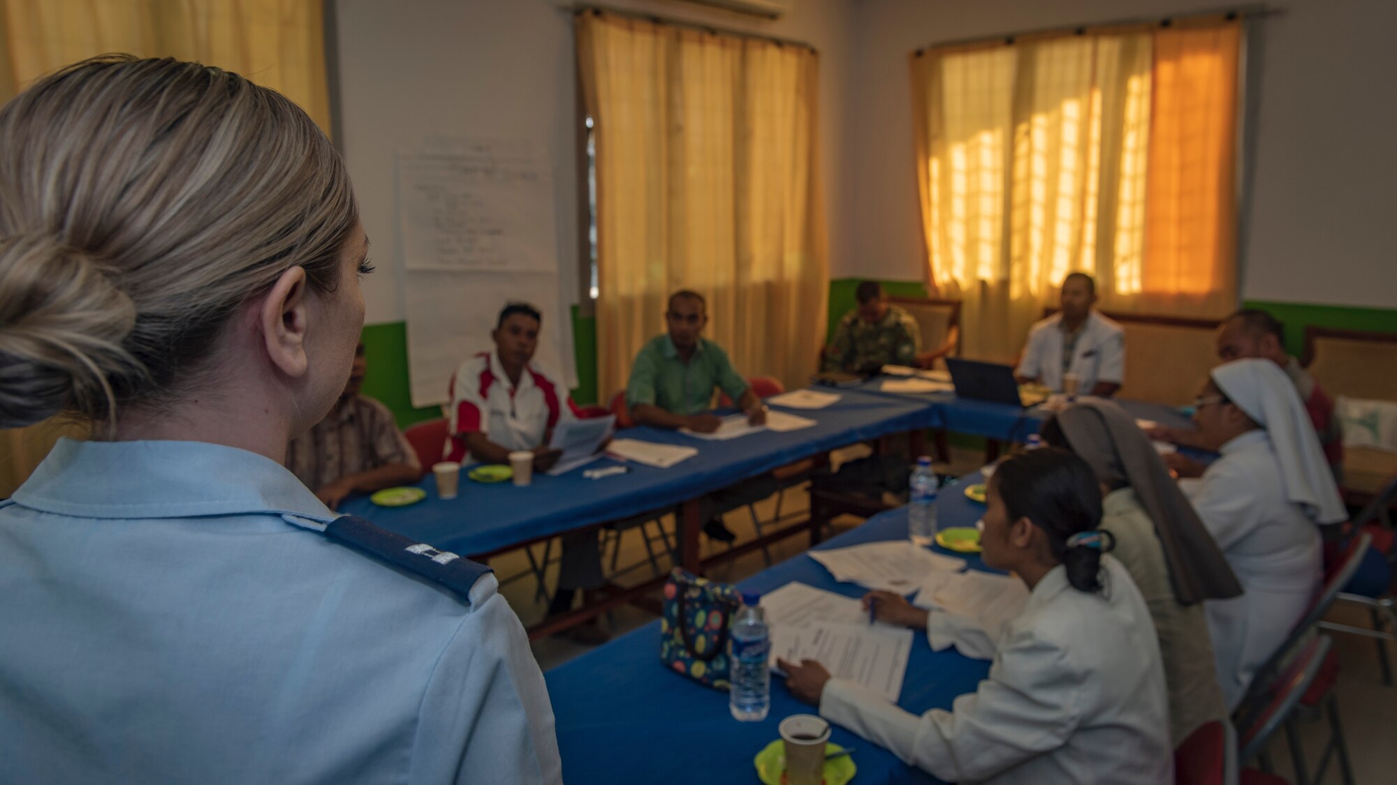 U.S. Air Force Capt. Elizabeth Persico, 35th Medical Operations Squadron health services provider, Misawa Air Base, Japan, talks with Timorese medical providers during a non-communicable diseases class and subject matter expert exchange during Pacific Angel 18-1 in Suai, Timor-Leste, June 8, 2018.