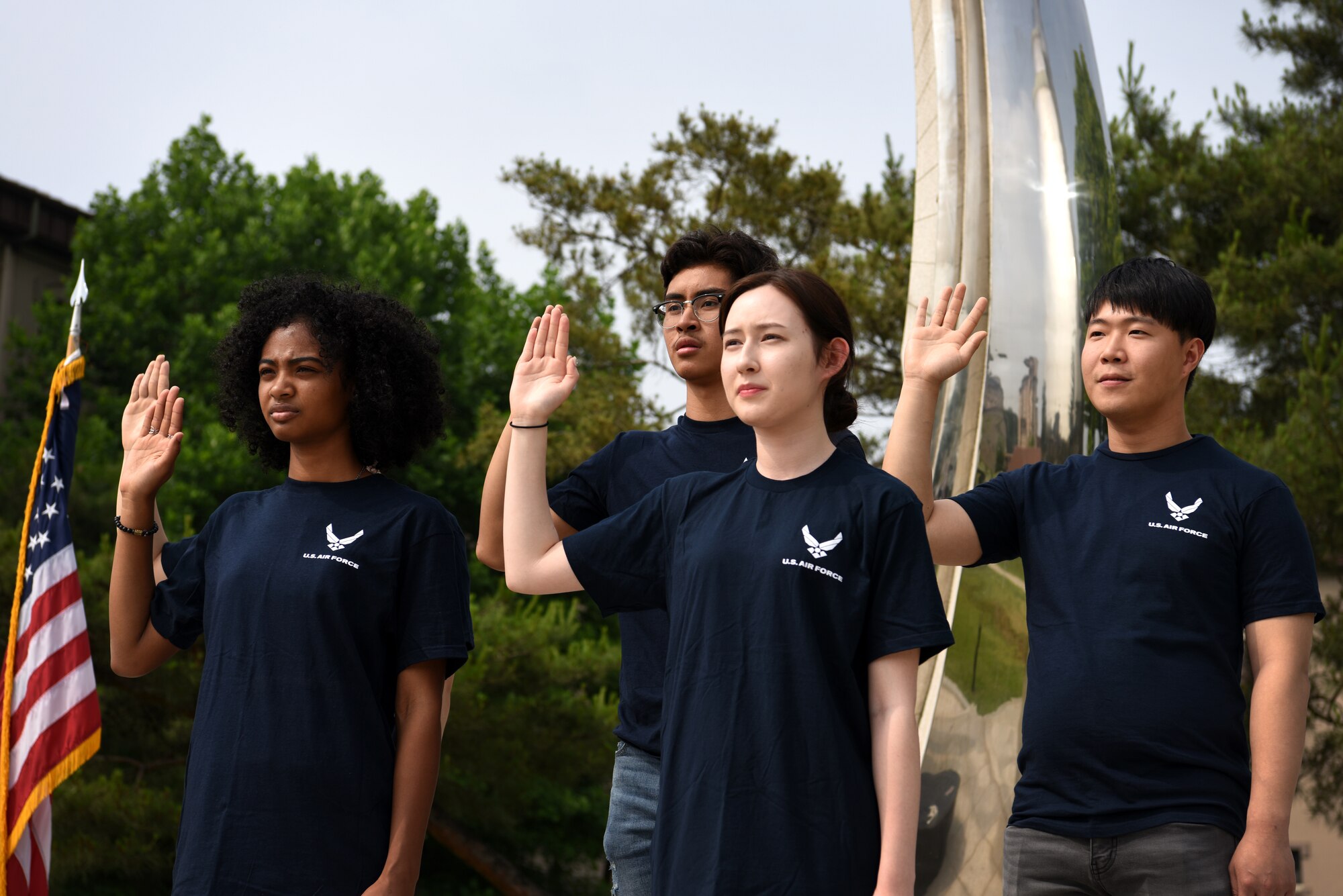 Five U.S. Air Force recruits participate in a swearing-in ceremony at Osan Air Base, Republic of Korea, June 8, 2018. The oath of enlistment used in a swearing-in ceremony is a military oath made on the occasion of joining or reenlisting in the United States armed forces. (U.S. Air Force photo by Senior Airman Kelsey Tucker)