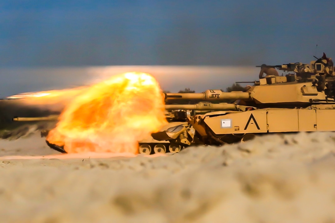 USTKA, Poland (June 9, 2018) A U.S. Marine Corps M1A1 Abrams tank attached to Tank Platoon, Fox Company, Battalion Landing Team, 2nd Battalion, 6th Marine Regiment, 26th Marine Expeditionary Unit, engage targets at night during live-fire training as part of exercise Baltic Operations (BALTOPS) 2018 at Ustka, Poland, June 9.
