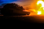 A tank fires at a target.