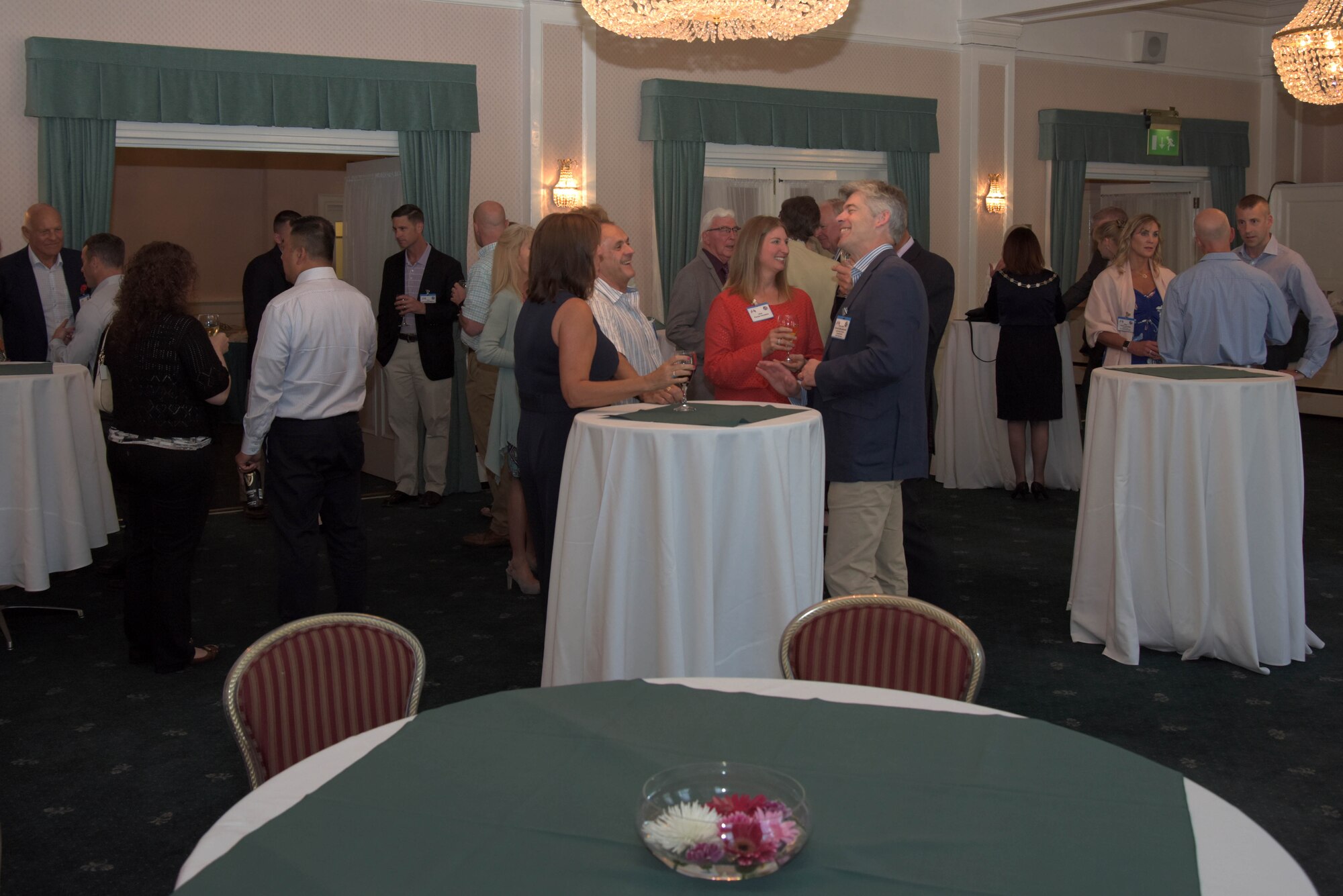 U.S. Air Force and local community leaders socialize at the 2018 Summer Reception at Middleton Hall on RAF Mildenhall, England, June 8, 2018. The reception welcomed civic leaders onto the base to discuss the unique role the United States Visiting Forces have throughout the United Kingdom. (U.S. Air Force photo by Airman 1st Class Benjamin Cooper)