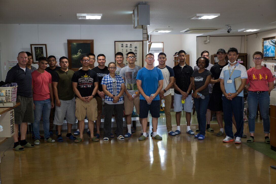 Marines and Sailors volunteer at Ai-no-Mura Senior Citizen Home, Kitanakagusuku, Okinawa, Japan, June 9, 2018. Marines and Sailors volunteer to upkeep the senior citizen home to improve the quality of life.  Volunteering is a great method to interact and build lasting relationships within the local community. (U.S. Marine Corps photo by Pfc. Ryan Persinger)