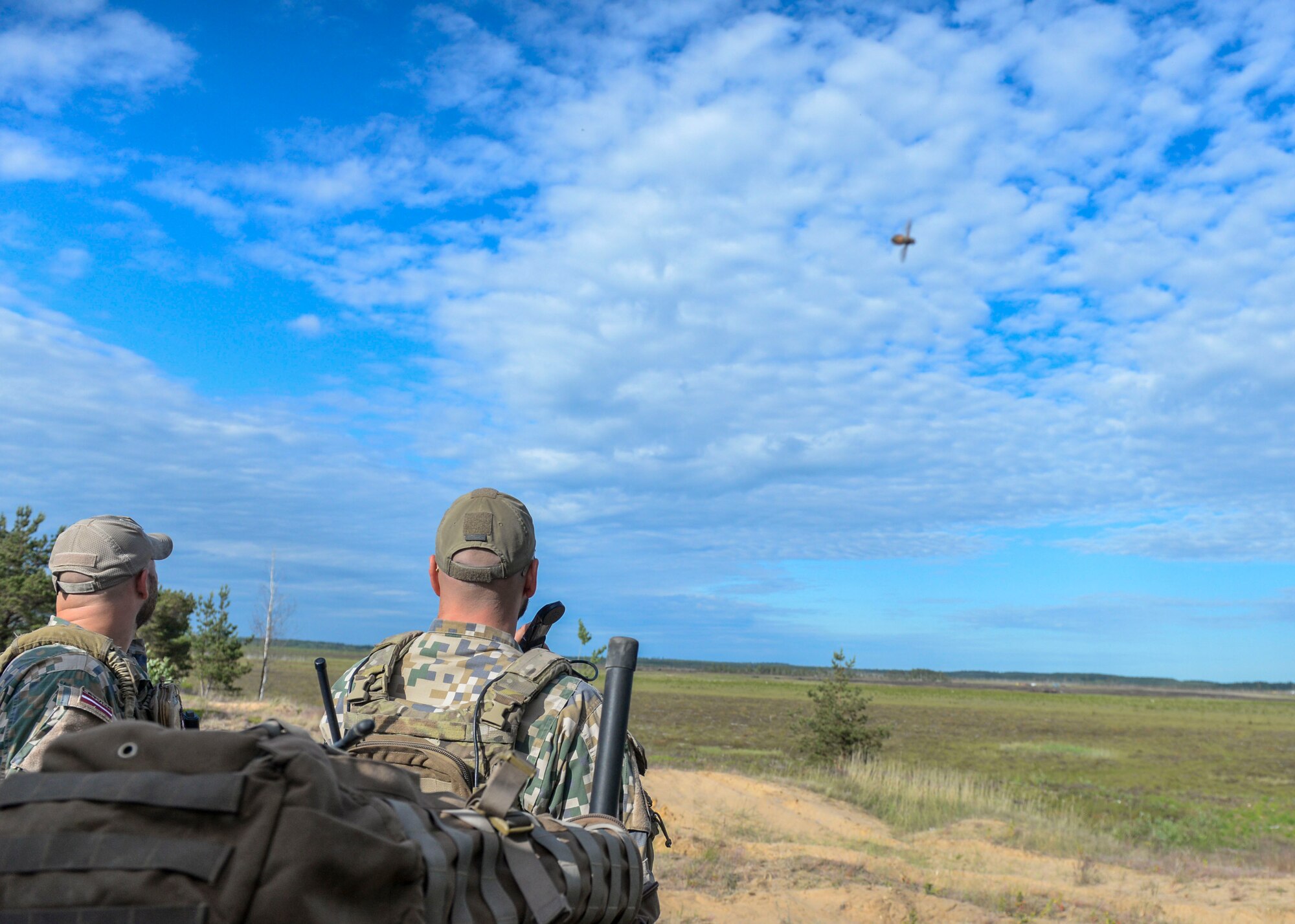 Latvian Joint Terminal Attack Controllers watch an A-10 Thunderbolt II provide close air support during Saber Strike 18 in Adazi, Latvia on June 7, 2018. Nineteen nations attended and participated in the exercise to build on each nation’s capabilities and improve partnership capacity. (U.S. Air Force photo by Staff Sgt. Jimmie D. Pike)