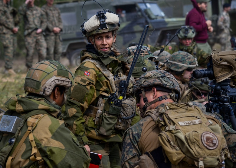 A Norwegian Joint Terminal Attack Controller discusses operations with U.S. Forces during Saber Strike 18 in Adazi, Latvia, June 5, 2018. Nineteen nations attended and participated in the exercise to build on each nations capabilities and improve partnership capacity. (U.S. Air Force photo by Staff Sgt. Jimmie D. Pike)