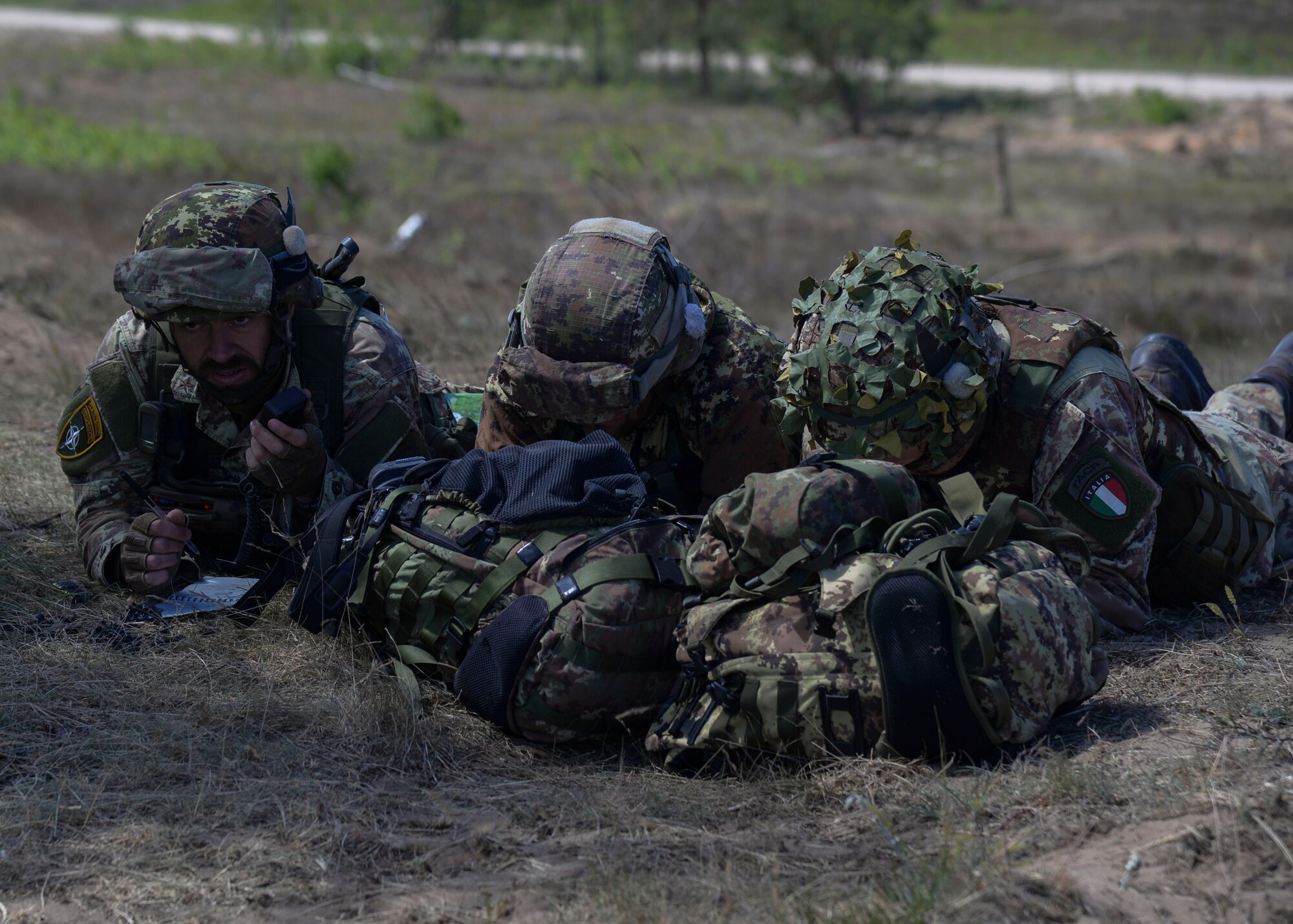 Italian Joint Terminal Attack Controllers call in close air support during Saber Strike 18 in Adazi, Latvia, June 5, 2018. Countries participating in Saber Strike had the opportunity to practice combining the air and land components of warfighting to strengthen partnership capabilities. (U.S. Air Force photo by Staff Sgt. Jimmie D. Pike)