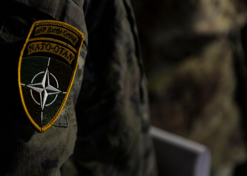 A NATO enhanced Forward Presence Battle Group patch rests on the shoulder of a member of a NATO ally in Adazi, Latvia on June 5, 2018. Allies from NATO and regional partners from the Baltics took part in Saber Strike 18 to hone on skills that help to maintain security in the region. (U.S. Air Force photo by Staff Sgt. Jimmie D. Pike)