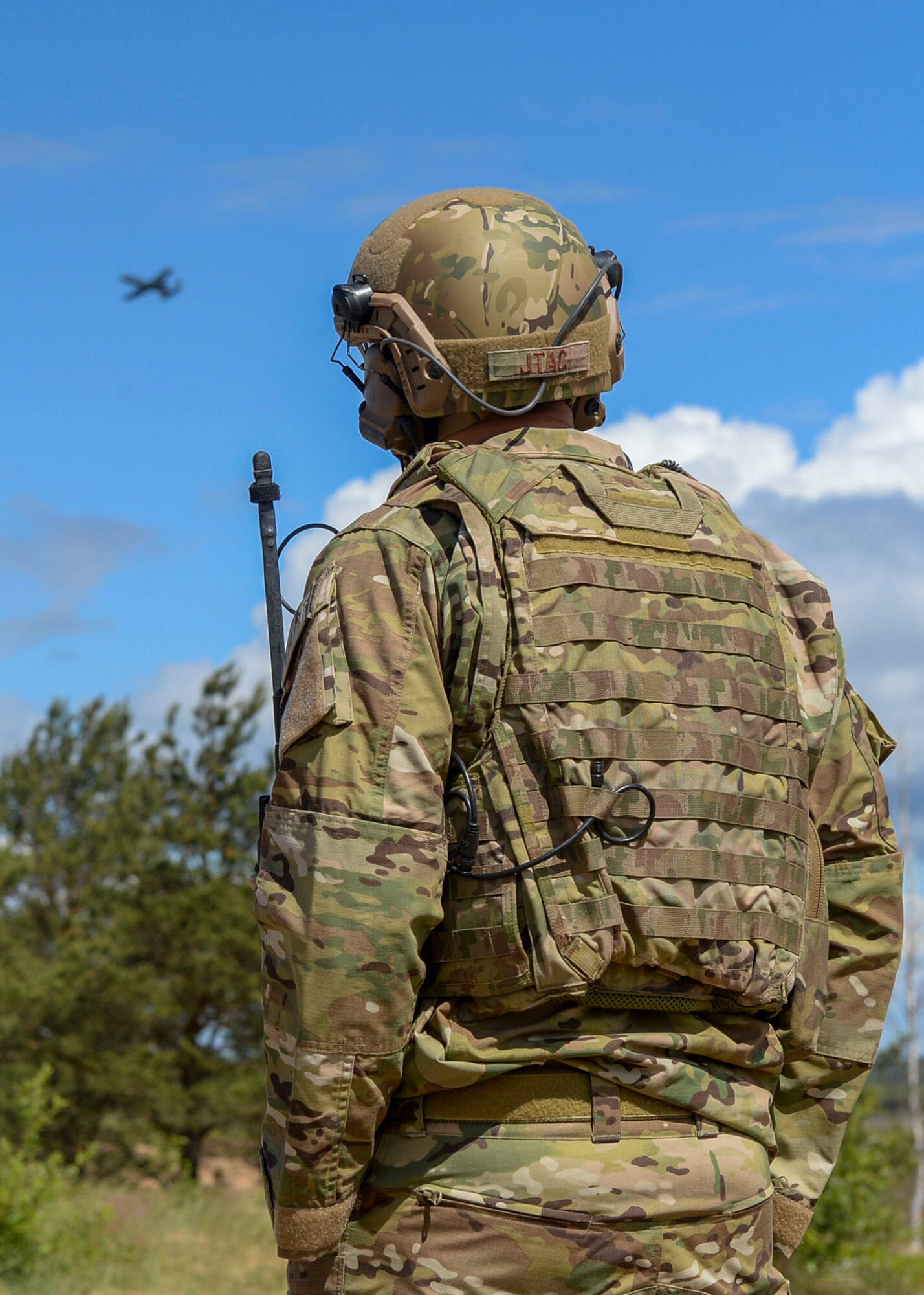 A U.S. Air Force Airman watches an A-10 Thunderbolt II perform close air support maneuvers during Saber Strike 18 in Adazi, Latvia, June 5, 2018.  Saber Strike 18 is a U.S. Army Europe led exercise aiming to build stronger operational partnerships between the U.S. and 19 of its allies, to include regional partners: Estonia, Latvia, Lithuania, and Poland. (U.S. Air Force photo by Staff Sgt. Jimmie D. Pike)