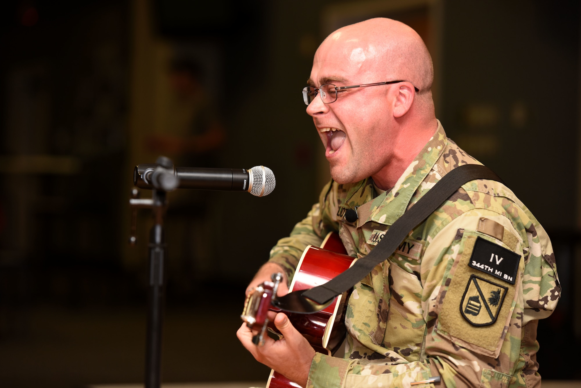 U.S. Army Spc. Michael Pouliot, 344th Military Intelligence Battalion trainee, sings while playing an original song during the Goodfellow’s Got Talent Show at the Event Center on Goodfellow Air Force Base, Texas, June 8, 2018. Pouliot placed third in this year’s competition. (U.S. Air Force photo by Airman 1st Class Seraiah Hines/Released)