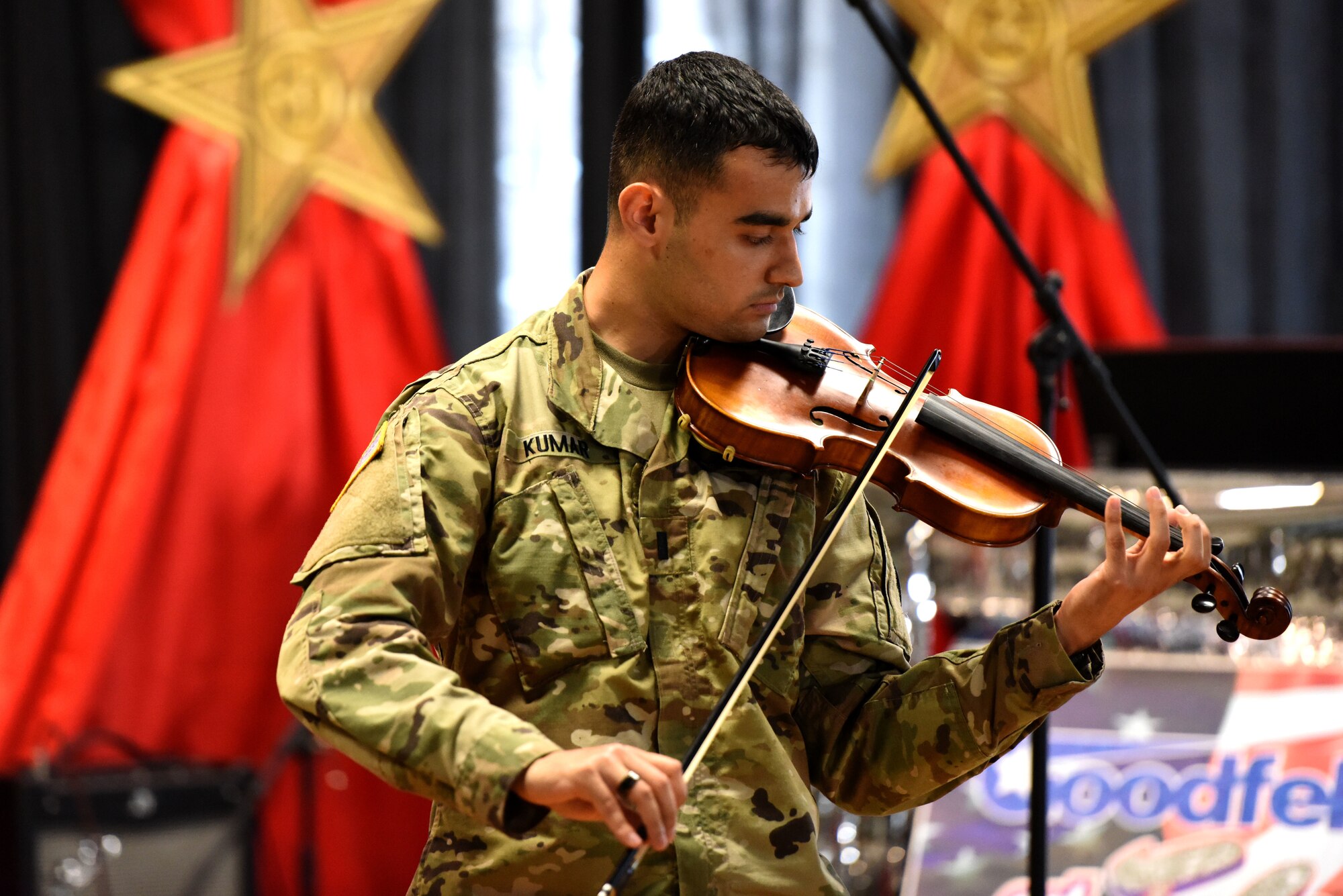 U.S. Army 1st Lt. Anjanay Kumar, 344th Military Intelligence Battalion company executive officer, plays selections on his violin for the Goodfellow’s Got Talent Show at the Event Center on Goodfellow Air Force Base, Texas, June 8, 2018. All members and dependents were encouraged to take part in the 2nd base-wide talent show. (U.S. Air Force photo by Airman 1st Class Seraiah Hines/Released)