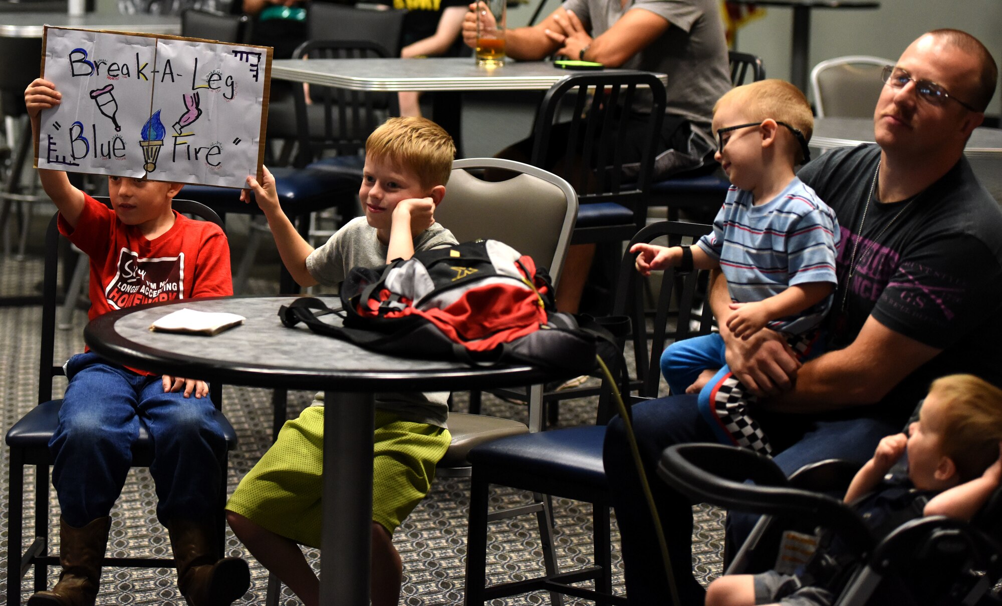 Family members of a competitor at the Goodfellow’s Got Talent Show display their support during the performance at the Event Center on Goodfellow Air Force Base, Texas, June 8, 2018. There were a total of 12 participants in this year’s competition. (U.S. Air Force photo by Airman 1st Class Seraiah Hines/Released)