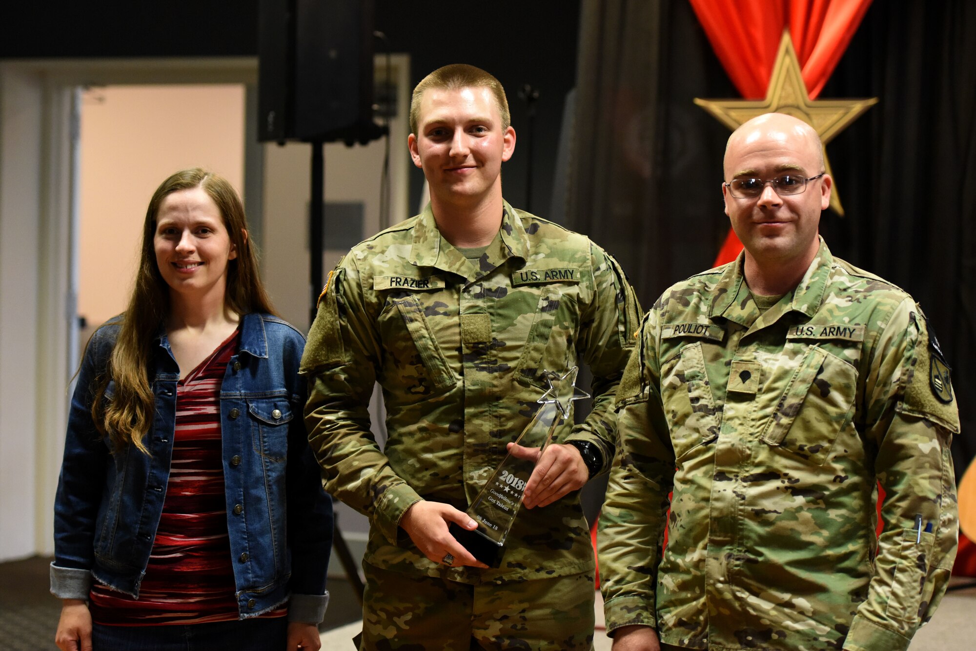 Goodfellow’s Got Talent winners, Sariah Berglund, U.S. Army Pvt. Chris Frazier, 344th Military Battalion trainee, and U.S. Army Spc. Michael Pouliot, 344th Military Intelligence Battalion trainee, braved the audience and performed at the competition in the Event Center on Goodfellow Air Force Base, Texas, June 8, 2018. The participants showcased a variety of talents, including, stand-up comedy, singing, playing guitar and other instruments. (U.S. Air Force photo by Airman 1st Class Seraiah Hines/Released)