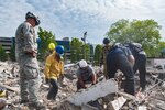 Soldiers from the West Virginia National Guard’s Joint Interagency Training and Education Center teamed up with the Charleston Fire Department search and extraction team June 8, 2018 at a Charleston Area Medical Center (CAMC) property in the midst of being demolished to conduct real-life search and extraction training. JITEC Search and Rescue instructors joined the fire fighters to sharpen their skills as instructors and bring their training experiences back to the Guard to enhance first responder capabilities.