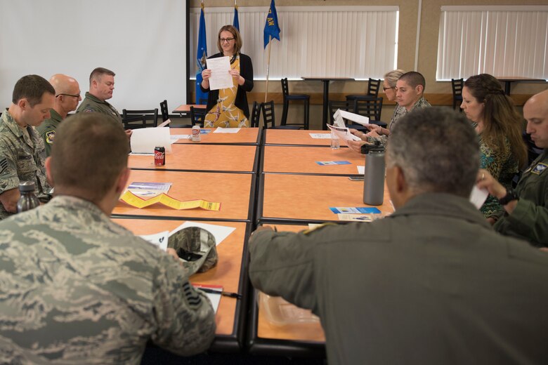 Tiffany Hendershot, a clinical social worker for Berkeley County, W.Va. schools and an aircraft maintenance non-destructive inspection technician for the 167th Airlift Wing, discusses the impact opioid use is having on students in Martinsburg, W.Va., during a lunch and learn event at the Wing, May 30. Hendershot urged participants to get involved with the local schools, volunteer and mentor students.  (U.S. Air National Guard photo by Senior Master Sgt. Emily Beightol-Deyerle)