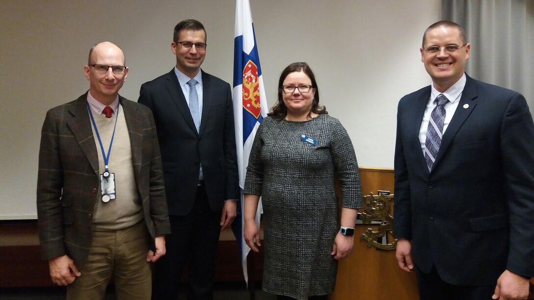 Defense Contract Management Agency United Kingdom leadership met with Defence Command Finland government quality assurance representatives March 22 in Nammo Lapua, Finland. DCMA U.K. commander, Air Force Lt. Col. Paul Ferguson (right) presented DCF quality assurance representative Johanna Lehmusoka (center right) with a coin in recognition of her surveillance on the Scalable Offensive Hand Grenade contract. Finnish Army Lt. Col. Tim Lindén (left) and Director of Government Quality Assurance Oula Heikkinen are also pictured. (DCMA photo by Paul Hudson)