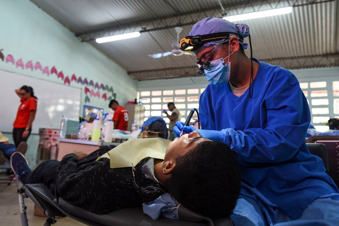 An Air Force dentist treats a patient.