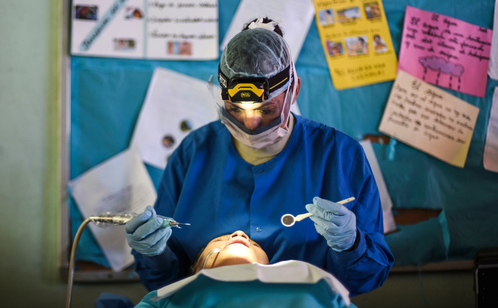 An Air Force dentist treats a patient.