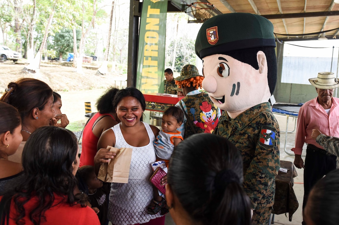 Mascots for the Panamanian National Border Service, known as SENAFRONT, greet guests