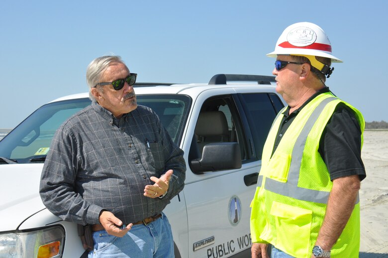 Burton “Burt” Moore, right, with the Savannah District, U.S. Army Corps of Engineers, discusses beach renourishment on Tybee Island, Georgia, with Joe Wilson, that town’s director of public works. Moore oversees beach renourishments as part of his duties as the dredging manager for the Savannah District. In the spring of 2018, the Savannah District undertook the task of renourishing parts of Tybee’s beach eroded by Hurricane Matthew in 2016. The $4.3 million contract took approximately 250,000 cubic yards of pristine beach sand from a “borrow site” about a mile offshore and placed in onto specified areas of the beach. Beach renourishment helps protect the city from future storms. (U.S. Army Corps of Engineers photo by Billy Birdwell.)