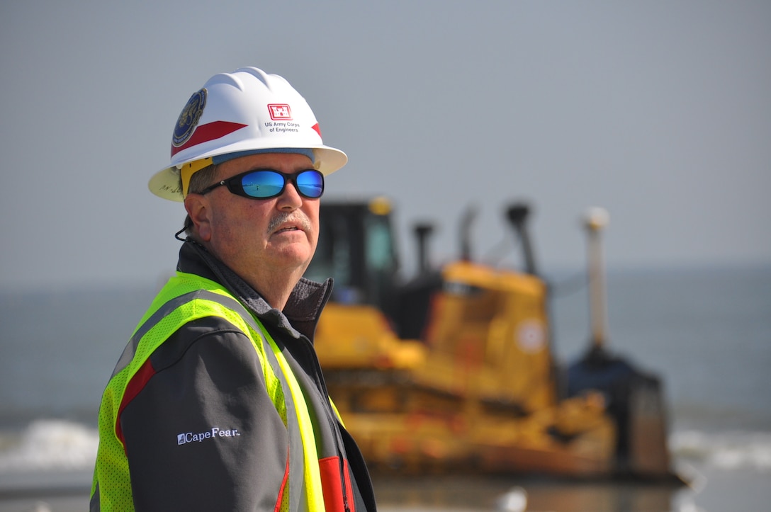 Burton “Burt” Moore, Chief of the Dredging Section of the Savannah District, U.S. Army Corps of Engineers, surveys the beach renourishment at Tybee Island, Georgia. Moore oversees the work to repair beach erosion caused by Hurricanes Matthew and Irma in 2016 and 2017. Renourishing the beach will help mitigate damage from future storms striking the small Georgia resort town. The Corps of Engineers awarded the work contract to Great Lakes Dredge and Dock Company. Tybee Island sits adjacent to the Savannah harbor shipping channel, a federal navigation project. The Corps of Engineers continues its Savannah Harbor Expansion Project to deepen the entire harbor from its current 42-foot depth to 47 feet. Dredging crews completed the outer harbor, also known as the outer channel, deepening in the spring of 2018. (U.S. Army Corps of Engineers photo by Billy Birdwell.) (Photos taken on April 11, 2018.)