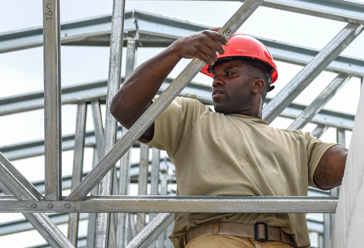 An Air Force engineer assembles a roof