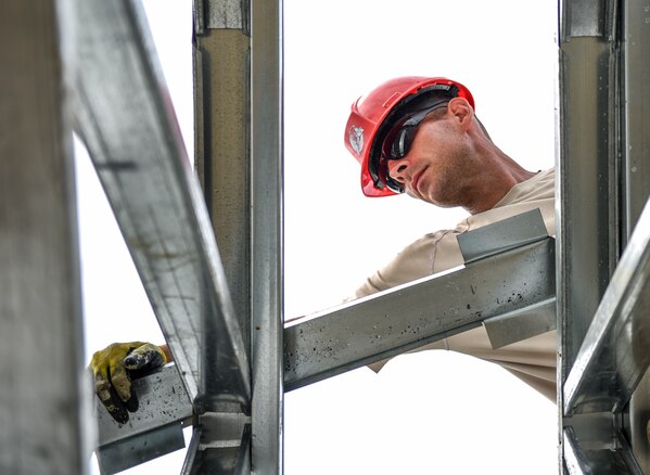 An Air Force engineer assembles a roof