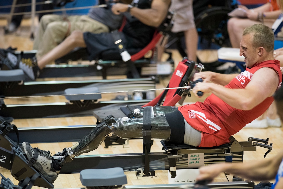 A Marine takes part in an indoor rowing competition.