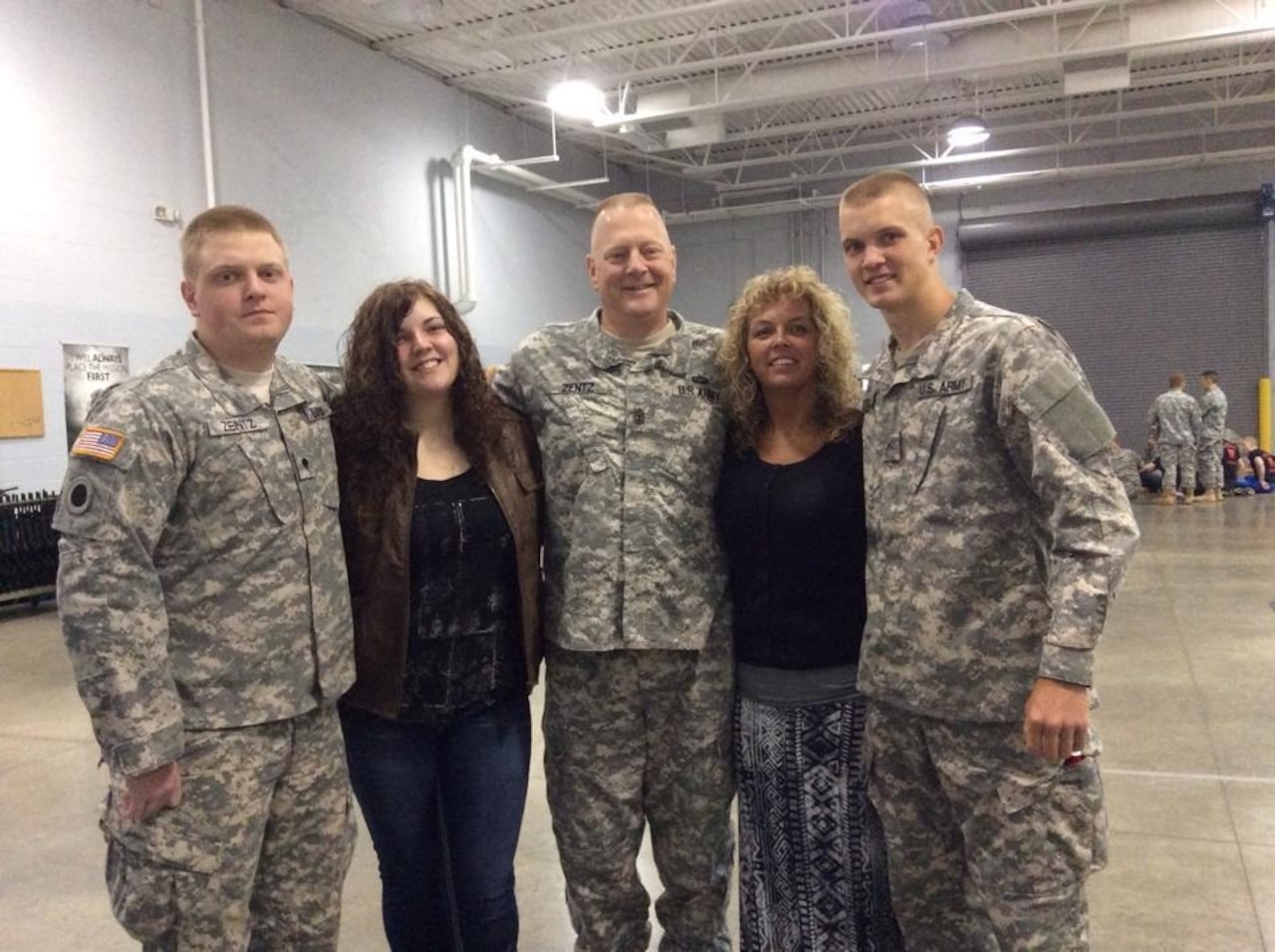 A military family poses for a photo.