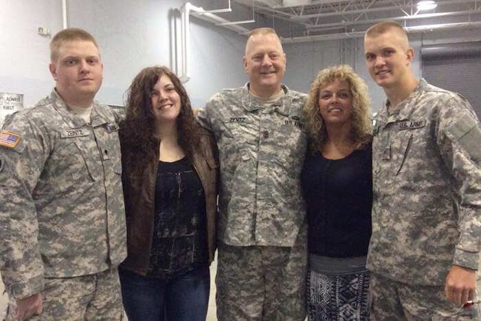 A group of people pose for a photograph.