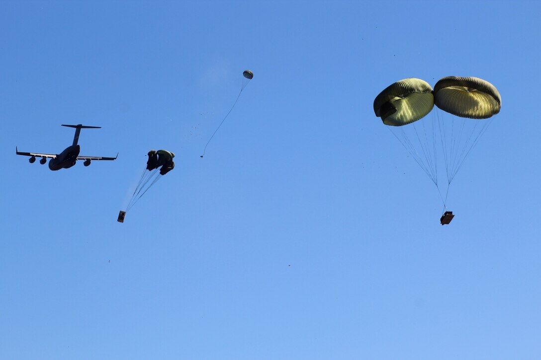 Army howitzers are airdropped into Eagle drop zone in Poland.