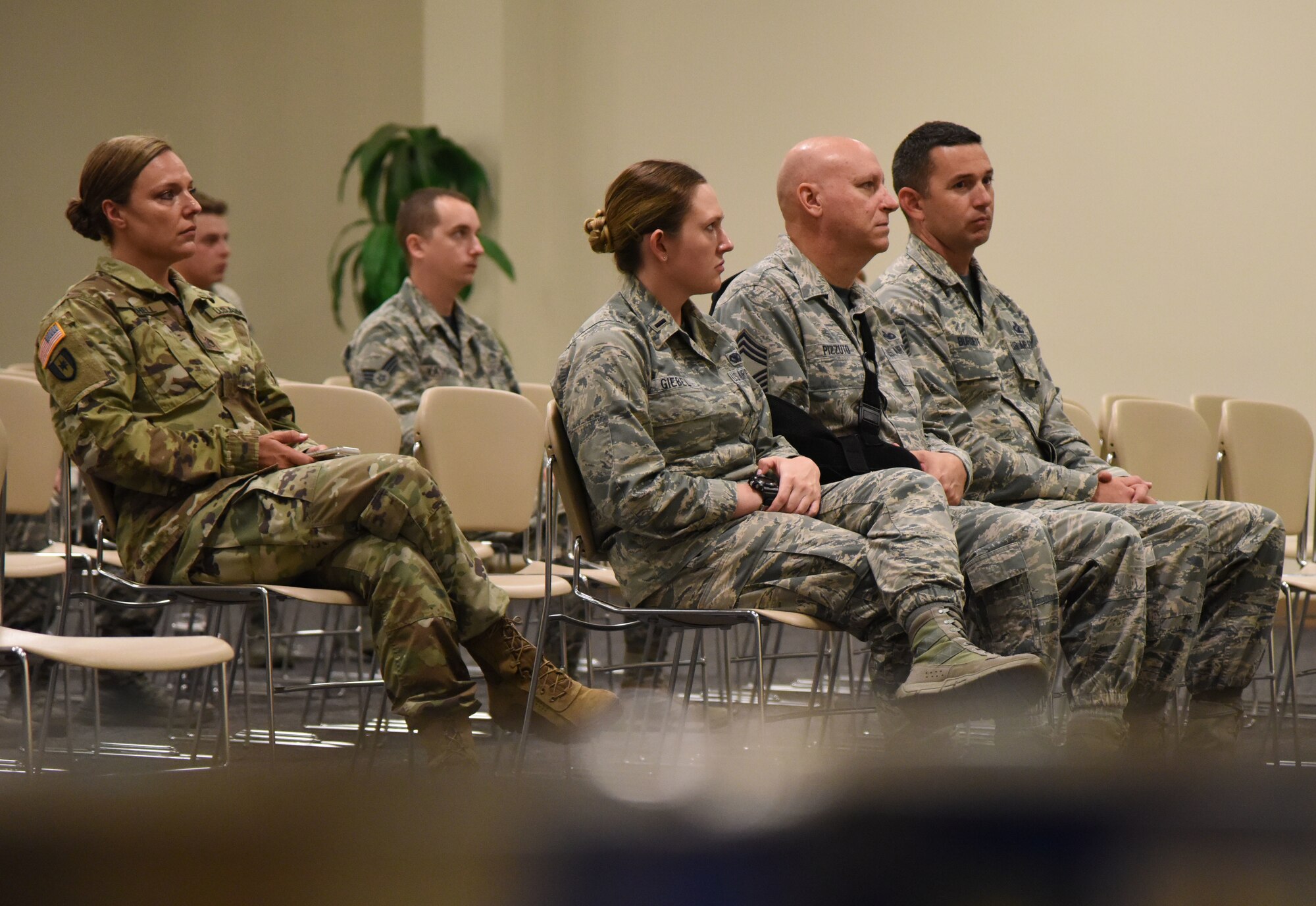 Members from the 81st Security Forces Squadron attend the retirement ceremony for Toki, 81st SFS military working dog, at the Roberts Consolidated Aircraft Maintenance Facility at Keesler Air Force Base, Mississippi, June 8, 2018. Toki retired with over 10 years of military service, which included four deployments. (U.S. Air Force photo by Kemberly Groue)