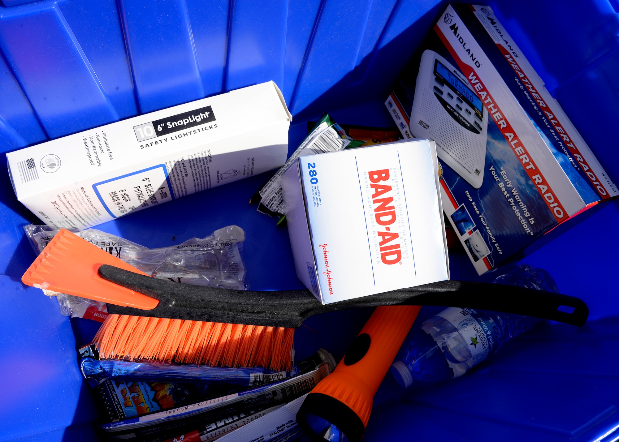 The 436th Civil Engineer Squadron emergency management flight provides an example of items needed in a disaster supply kit May 24, 2018, during a hurricane block party in base housing on Dover Air Force Base, Del. A disaster supply kit is a collection of basic items your household may need in the event of an emergency; the contents should sustain your entire family for up to 72 hours. (U.S. Air Force photo/Tech. Sgt. Matt Davis)