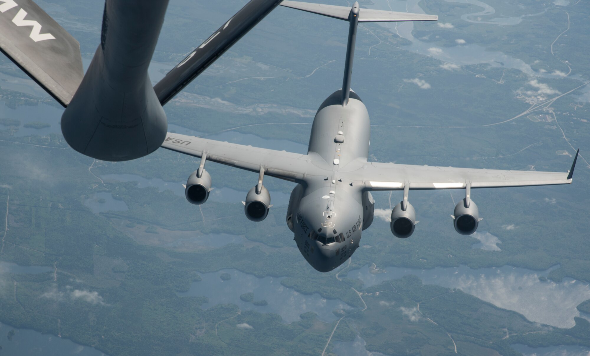 A C-17 Globemaster III aircraft assigned to the 62nd Airlift Wing from Joint Base Lewis-McChord, Wash., prepares to receive fuel over Canada, during Exercise Swift Response 18 (SR18), June 8, 2018.