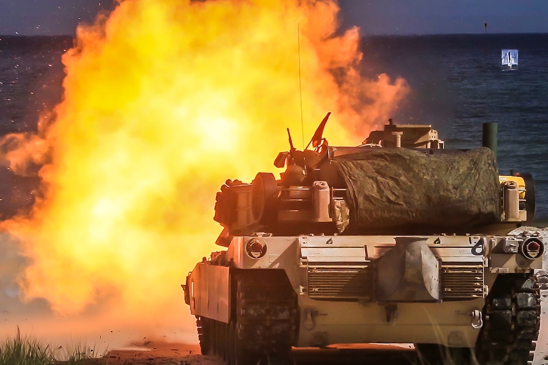 A Marine Corps M1A1 Abrams tank engages targets during live-fire training.