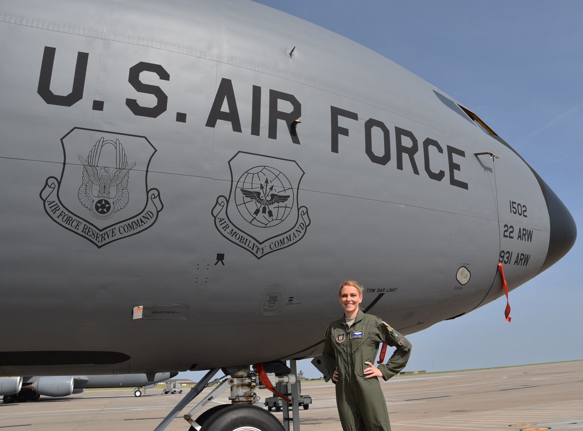 Reserve Citizen Airman Maj. Monica Riggs poses in front of a KC-135 Stratotanker June 12, 2018, McConnell Air Force Base, Kan. Riggs recently traded in her flight suit and combats boots, donning an evening gown and six-inch heels to be crowned as Mrs. Kansas United States 2018.  Riggs’ victory means she will go on to compete nationally for Mrs. United States.  The competition is slated for the first week of July in Orlando, Fla.