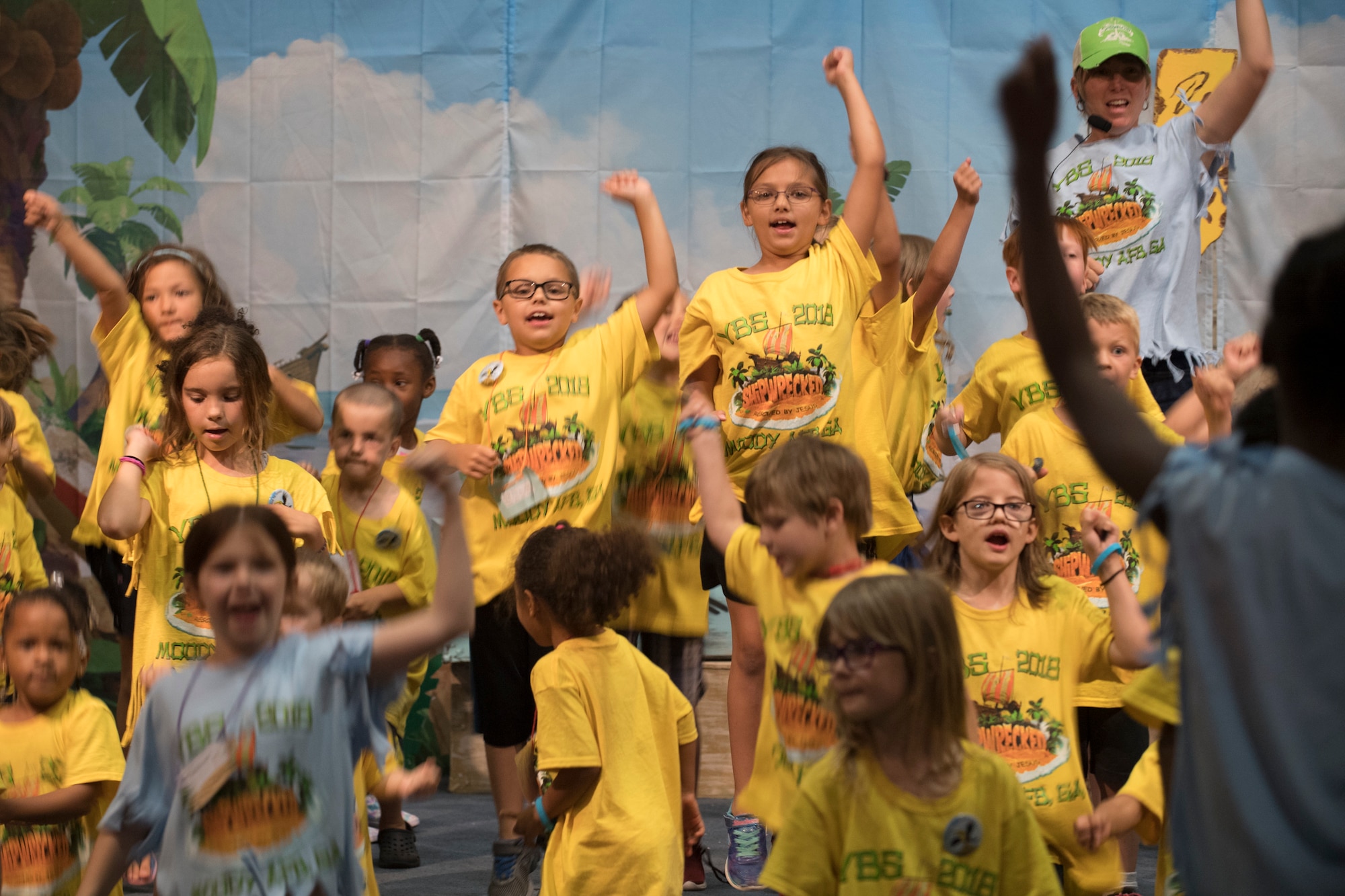 Children and volunteers sing and dance at a Vacation Bible School finale event, June 8, 2018, at Moody Air Force Base, Ga. VBS is designed to assist children in building resiliency to the stressors many military families face. More than 95 children and 65 volunteers attended this year’s VBS. (U.S. Air Force photo by Senior Airman Daniel Snider)