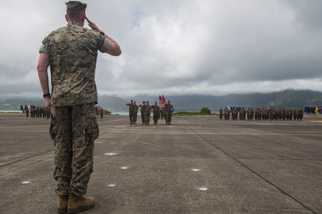 Lt. Col. Kenneth Phelps salutes U.S. Marines during a change of command ceremony, Marine Corps Air Station Kaneohe Bay, Marine Corps Base Hawaii, June 7, 2018. Lt. Col. Kenneth Phelps retired and relinquished command of Marine Unmanned Aerial Vehicle Squadron 3 to Lt. Col. Peter Ban. (U.S. Marine Corps photo by Lance Cpl. Matthew Kirk)