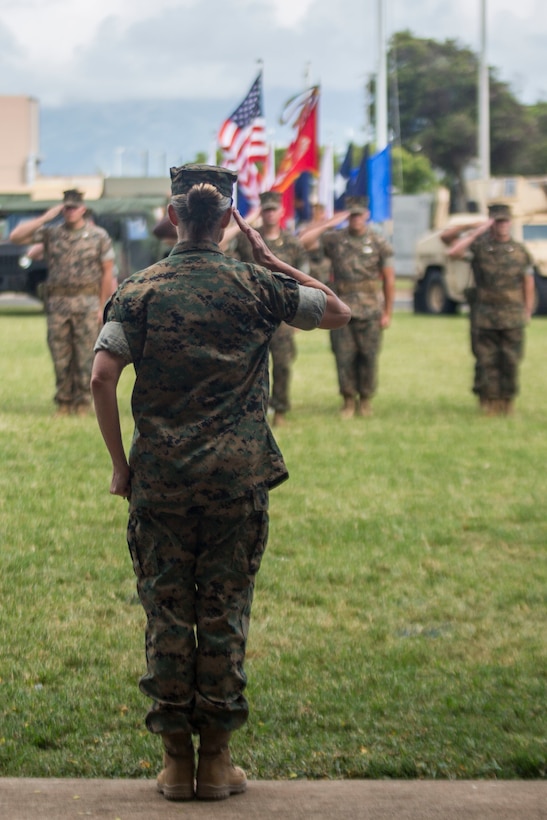 U.S. Marine Corps Col. Maura Hennigan, commanding officer, Combat Logistics Regiment 3, salutes during a change of command ceremony, Marine Corps Base Hawaii, June 8, 2018. Lt. Col. Bolivar Pluas relinquished command of Combat Logistics Battalion 3 to Lt. Col. Paul Goguen. (U.S. Marine Corps photo by Lance Cpl. Matthew Kirk)