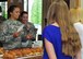 USO volunteers serve food to two soldiers from the Ohio National Guard’s 838th Military Police Company at Youngstown Air Reserve Station USO lounge June 8.