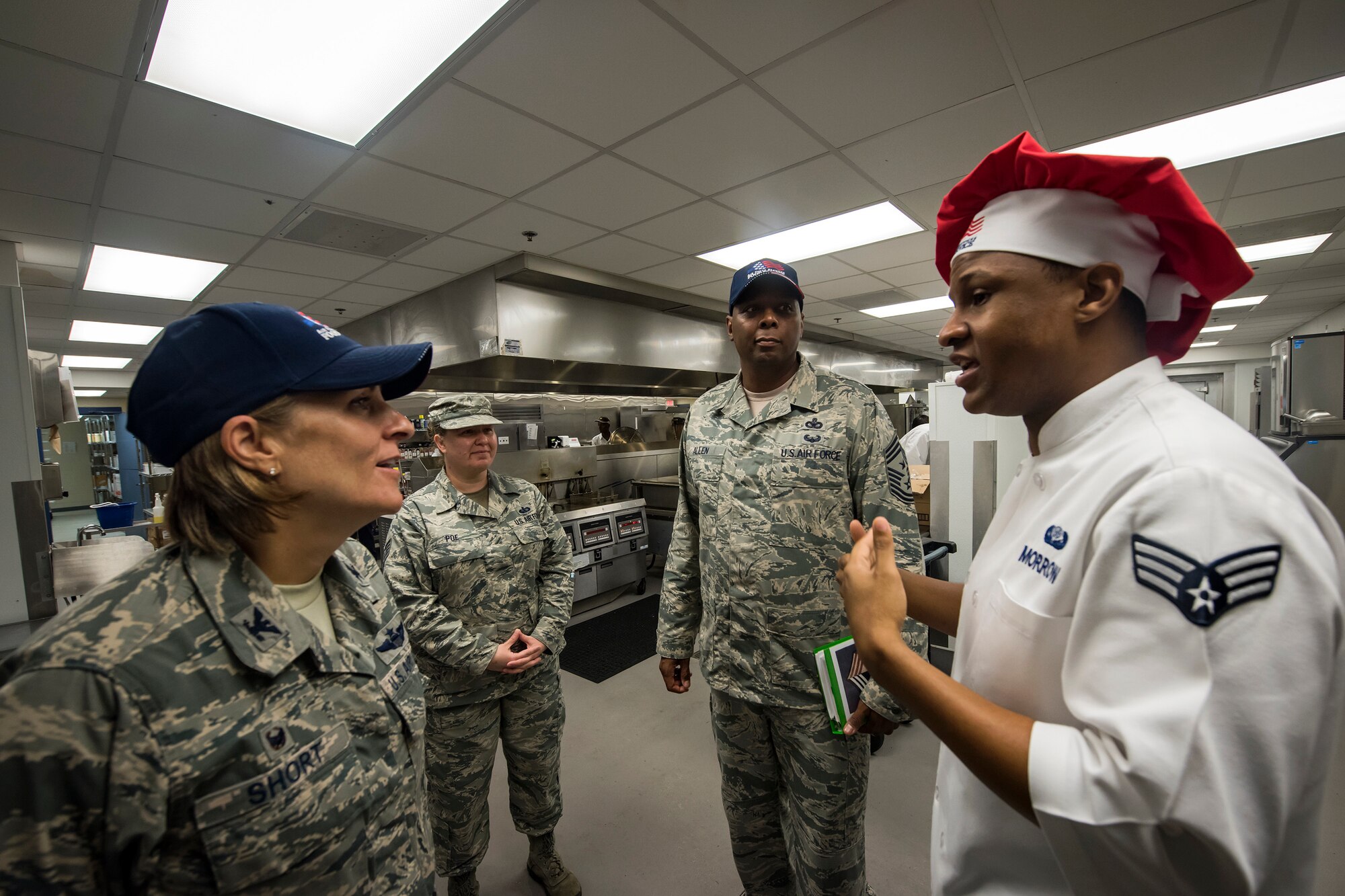 Senior Airman Cameron Morrow, right, 23d Force Support Squadron food service shift leader, briefs Col. Jennifer Short, 23d Wing (WG) commander, during an immersion tour, June 11, 2018, at Moody Air Force Base, Ga. Short and Chief Master Sgt James Allen, 23d WG command chief, toured the Georgia Pines Dining Facility and the Information Learning Center to gain a better understanding of their overall mission, capabilities, and comprehensive duties. (U.S. Air Force photo by Airman 1st Class Eugene Oliver)