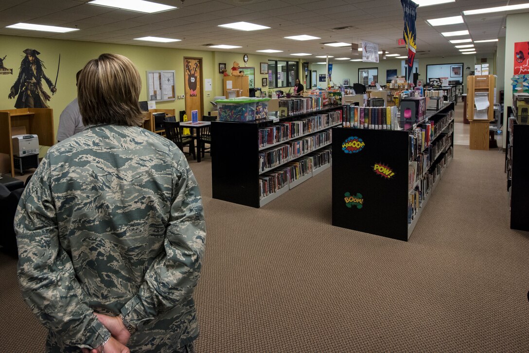 Col. Jennifer Short, 23d Wing (WG) commander, looks inside the library of the Information Learning Center (ILC) during an immersion tour, June 11, 2018, at Moody Air Force Base, Ga. Short and Chief Master Sgt James Allen, 23d WG command chief, toured the Georgia Pines Dining Facility and the ILC to gain a better understanding of their overall mission, capabilities and comprehensive duties. (U.S. Air Force photo by Airman 1st Class Eugene Oliver)