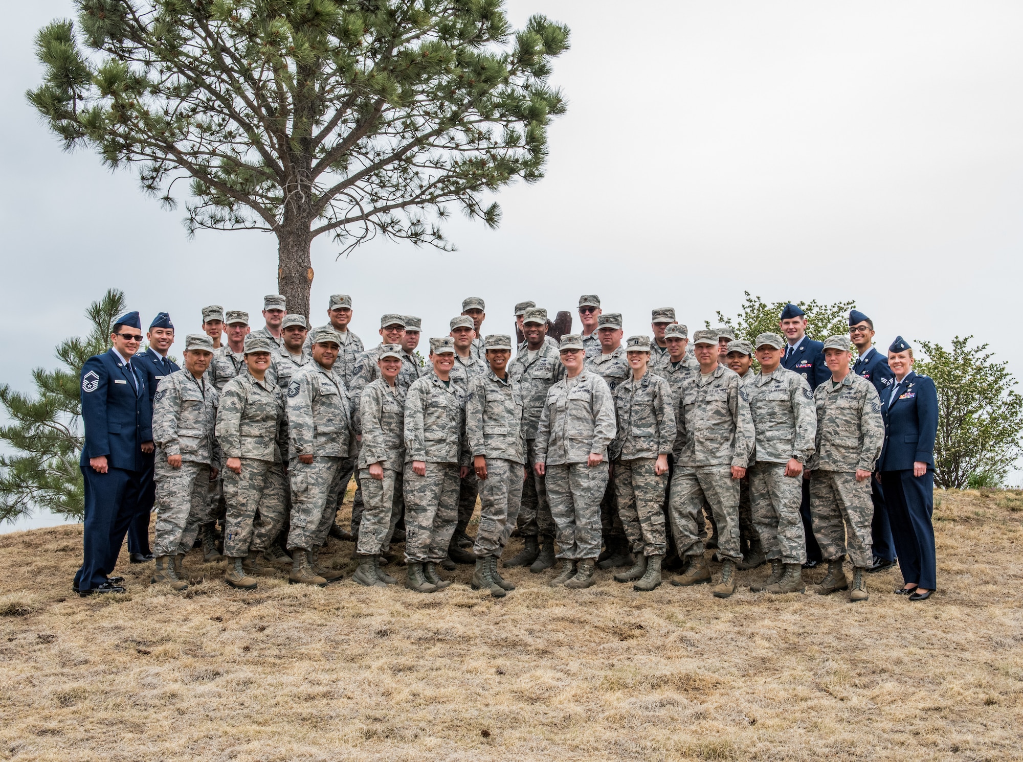 Members of the 19th Space Operations Squadron pose for a group photo with outgoing commander, Lt. Col. Karen Slocum, before the 19 SOPS Change of Command, June 3, 2018.